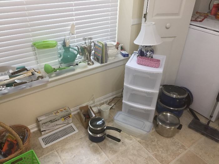 Pots and pans and plastic storage. 