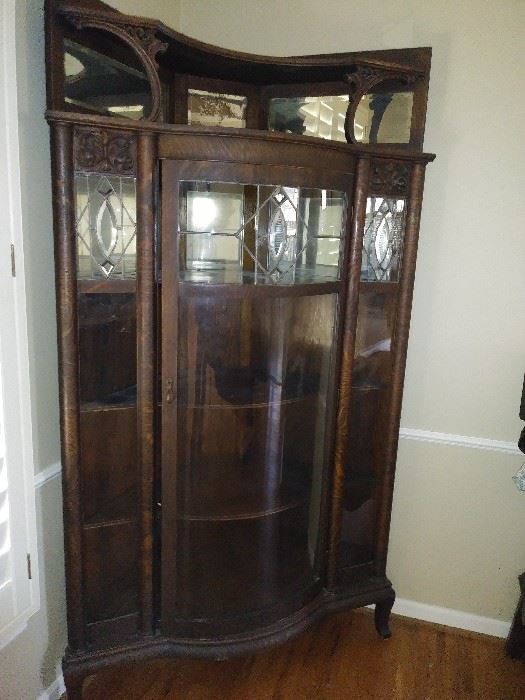Stunning curved front antique display cabinet