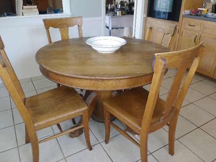 antique table and 4 antique chairs
