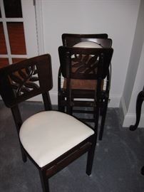 Set of four art deco carved wood folding chairs. Great for extra seating or game table seating. Made by Stakmore furniture co.