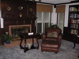 Leather chair and ottoman. Game table.