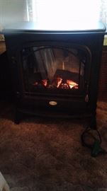 Charming electric fireplace heater.
