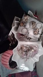Lots and lots and lots of jewelry! 100s of pieces, rings, pins, bracelets, watches, necklaces. Some gold, sterling, costume, new and vintage. Lots of Lia Sophia pieces