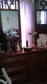 triple dresser with religious items