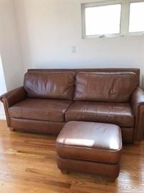 Really comfortable brown leather couch and ottoman.  Little worn on one side.  Still great for someone just starting out or that man cave.  $40.00