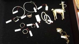 Sterling llama is unique. 4" long and 4+" high and stands upright as a figure. Jewelry is sterling.