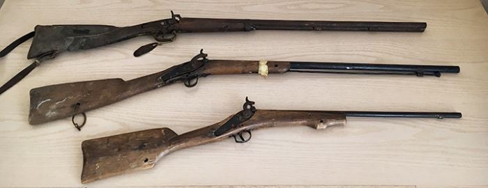 Antique rifles. Mid-1800's (19th Century). Top and middle is a Spanish rifle (brand unknown). Bottom is a replica. Top: $100. Middle: $50. Bottom: 15