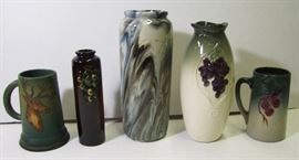 ~ C/1920's Weller cylinder vase w/marbled glaze ~ C/1910 Weller Floretta bud vase ~ C/1910 Weller Tankard w/cherries ~ C/1910 Weller Dickens Ware incised tankard w/elk ~ C/1920 Weller Floretta vase w/grapes ~