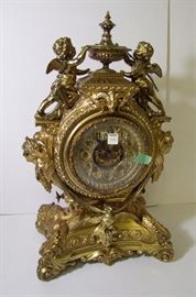 Clock #5 C/1890's Gilt French Louis 15th style mantle clock by Ansonia w/cherubs and fish, 20 1/2" h.