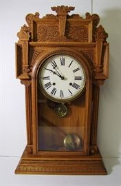 Clock # 22 C/1890 Oak cased Waterbury large mantle clock, Niagara pattern w/Oak columns, 28 1/2" h.