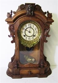 Clock # 77 C/1890 New Haven walnut Victorian w/Minerva head, mirrored sides, 24" h.