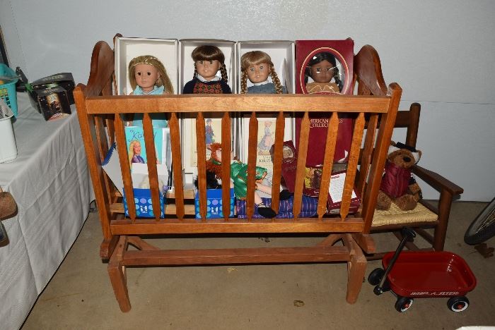 4 American Girl dolls with boxes