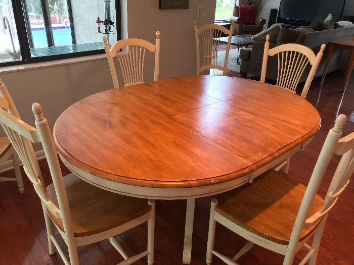 All wood oval dining table, six chairs (65" length)