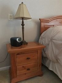 pine night stand, table lamp. alarm clock 