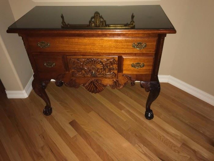 Solid wood, claw-footed chest.