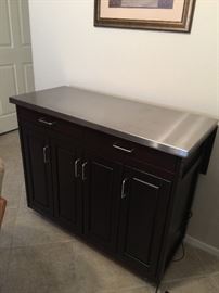 Cuisine Cart wood grain, stainless steel top approx 43 inch wide 31 inch depth (has extension to it in the back)