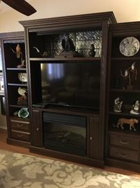 Beautiful 3 piece entertainment center , electric fireplace in the lower center of the unit, 55 inch Sony HD TV in the middle of the unit---all sold seperately