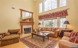 Leisure House distressed leather sofa and loveseat, Karastan carpet, Mahogany coffee table, paisley chair and ottoman