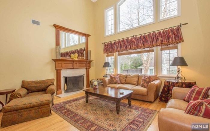 Leisure House distressed leather sofa and loveseat, Karastan carpet, Mahogany coffee table, paisley chair and ottoman