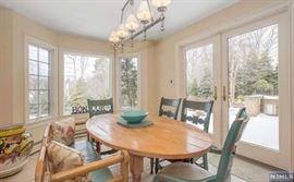 Stripped pine oval farm table, four. Painted country chairs, pine settee, large Italian majolica planter