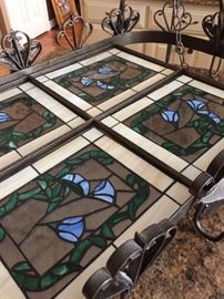 The hanging pot rack has stain glass.