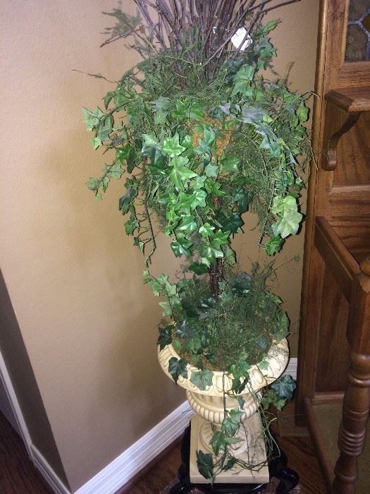 Greenery arrangement in white urn planter