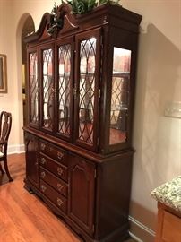 The china cabinet has 3 shelves for display and is lighted.