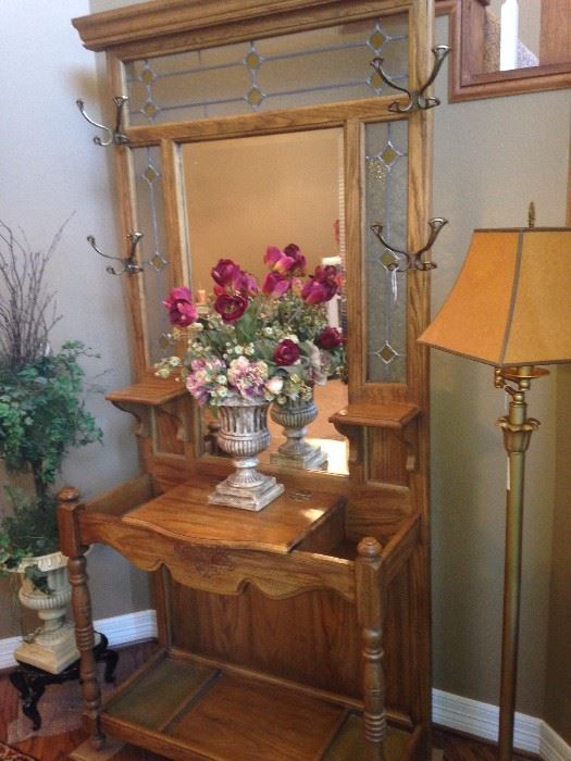 Oak mirrored hall tree with hooks and places for umbrellas; floor lamp; 2 floral/greenery arrangements