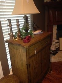 One drawer storage cabinet; brass candlesticks