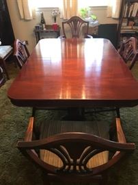 vintage dining room table with 2 leaves and 8 chairs