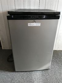 Small Frigidaire refrigerator, garage has a couple of refrigerators as well