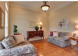 Sofa, love seat, sideboard, no maintenance plants, art, lamp