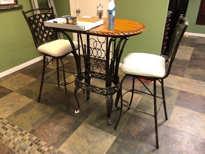 Table with wine rack, three chairs (one not pictured)