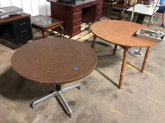 Two round tables, leaded glass end tables, desks