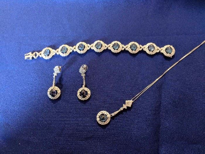Sapphire earrings, bracelet, and pendent, set in rhodium plated white gold.
Certificate of Appraisal available
