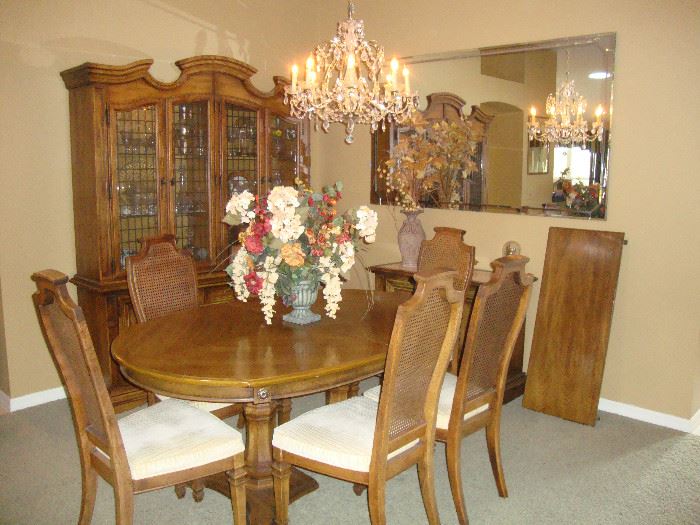 Dining room set. Oval table with 1 leaf, 6 cane back chairs