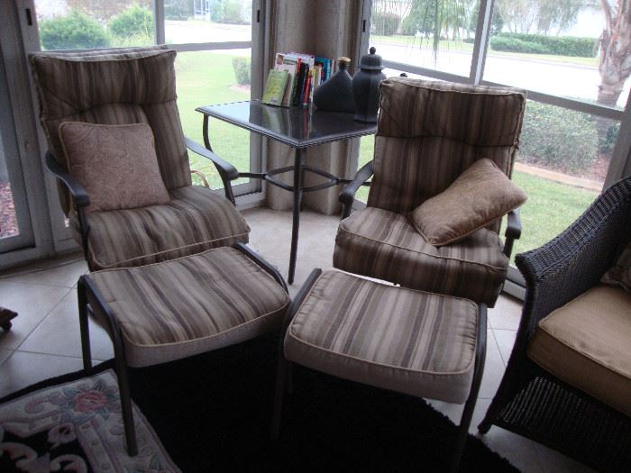 2 rocker/swivel chairs with ottomans