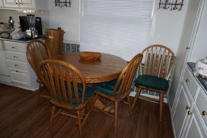 42" Oak table & 4 chairs with two 11" leaf extensions