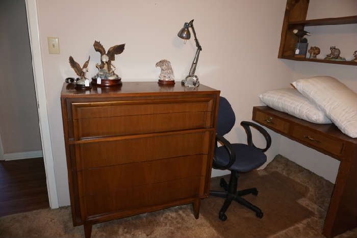 Mid-century chest of drawers by  Basic Whitz  furniture Co.                                                                                                                                  Eagle figurines, office chair