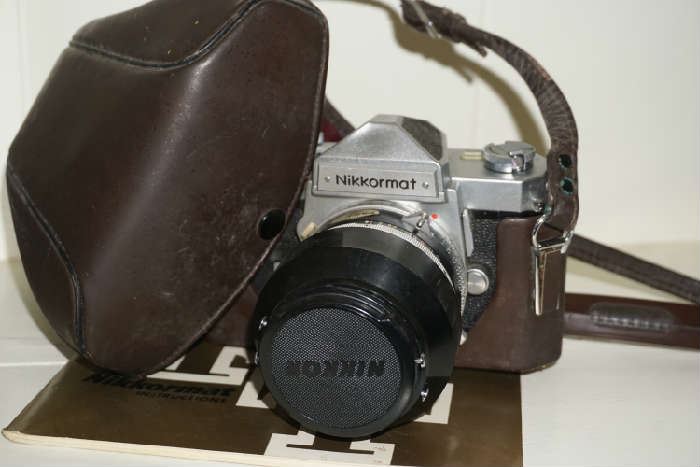 Nikkormat camera with 50 - 1.4 lens attached & manual