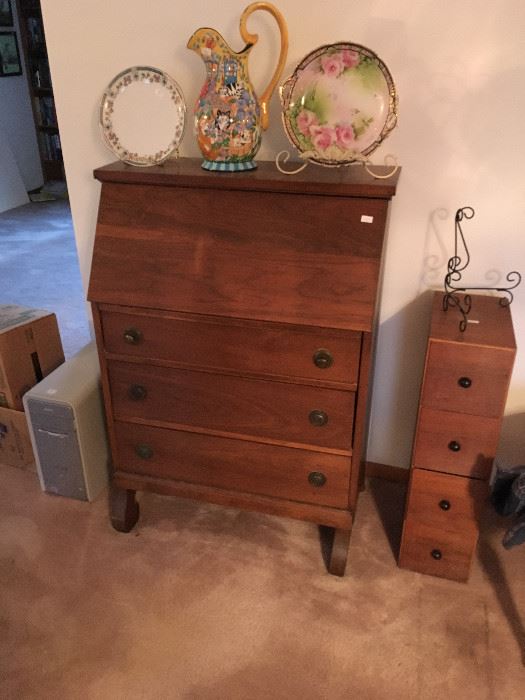 A nice desk/dresser combo in walnut -- nice piece.  Notice the cute little drawer unit next store and the nice Austrian plate and ewer.