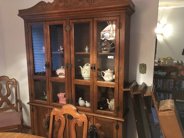 Beautiful lit china cabinet for display with lots of storage down below.