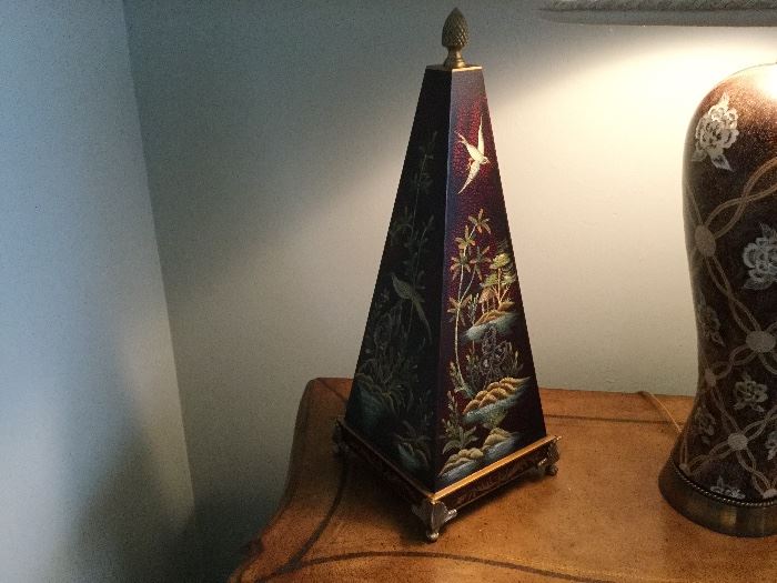 A pair of pyramids painted with nature scenes, base painted with fleur de lis and scroll design,  brass finial and 4 brass feet on each