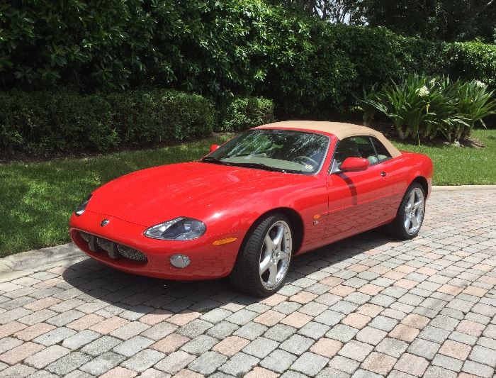 2003 XKR red Jaguar, 24,000 miles, factory special order, purchased new, selling in like-new condition, one owner, driven monthly, serviced regularly by Jaguar dealer to preserve original condition, never driven in rain, sleet, or snow, stored in private garage in pristine condition, no dings or scratches, 20” Detroit wheels, Racaro seats,  leather steering wheel and shift knob, special order carmel-tan top