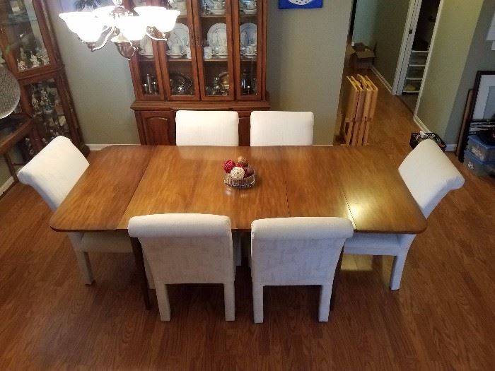 Drop Leaf Table and 6 chairs.  Max length fully expanded is 84 inches by 40 inches. Center leaf is 12 inches and there are two of them.
