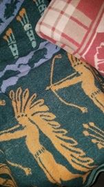 Much, much linens, blankets and quilts. Vintage camp blankets