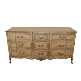 Hale French Provincial Style Dresser: A painted and glazed French Provincial style dresser by Hale. This dresser features silver-tone highlights, having a serpentine facade with nine drawers. Each dovetailed drawer has a framed front with cast foliate handles, on cabriole feet.