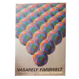 Vintage Offset Lithograph Poster on Paper After Victor Vasarely: A vintage offset lithograph poster on paper featuring renowned Pop artist Victor Vasarely (1906 – 1997). This print presents colorful spheres arranged in a V-shaped composition against a taupe ground. Type toward the lower edge details the work and publication information. This print is signed in plate to the lower left and presented under plastic, ready to hang.