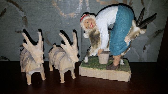 Swiss wood carving, she's milking the goat!