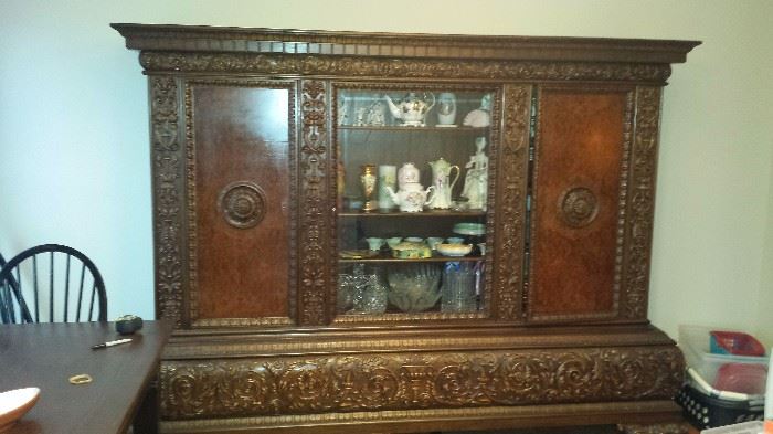 Beautiful European Hand Carved Buffet China Cabinet. Items Pictured in cabinet are not for sale. 